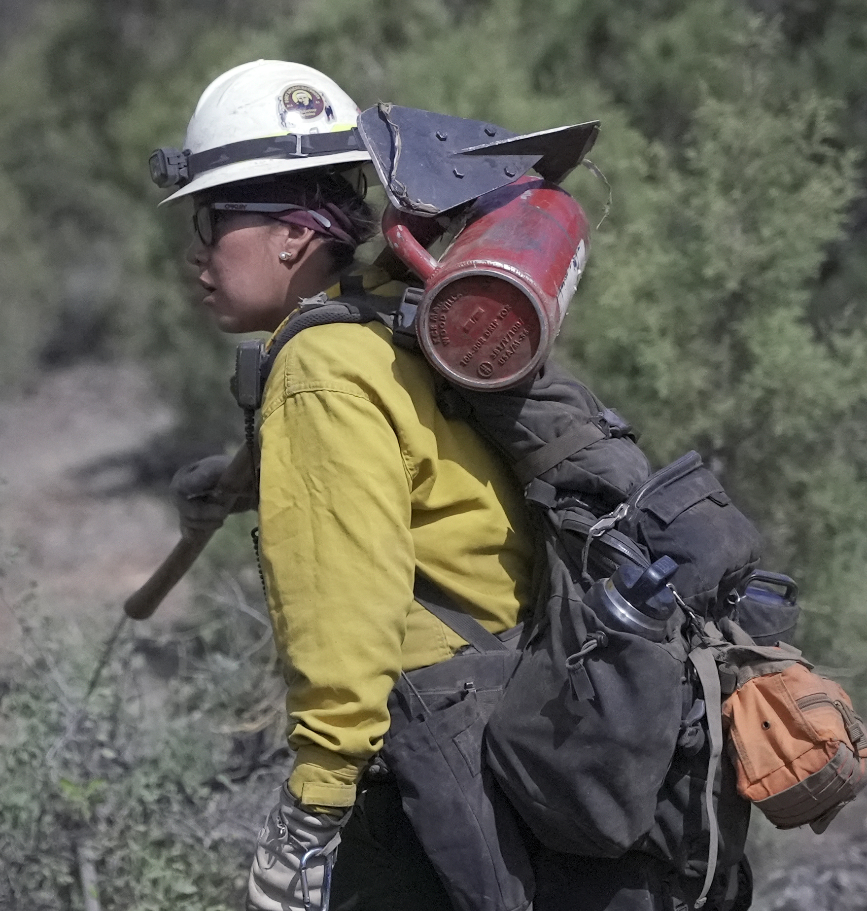 Fort Apache crewmember carrying drip torch. Photo by BIA
