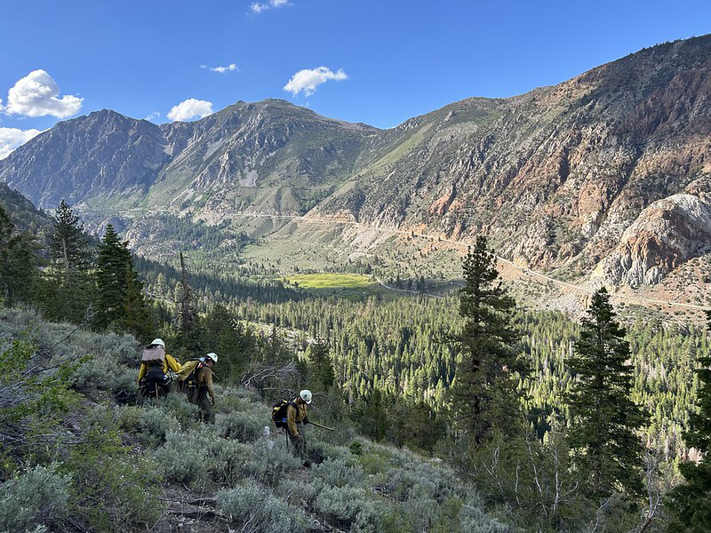 Wildland firefighters hike to a wildfire.