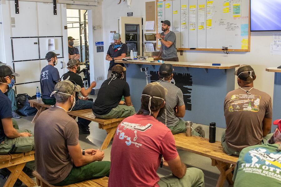 Great Basin Smokejumper at their morning briefing.